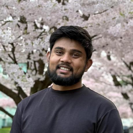 Kshitij Dani standing in front of cherry blossoms